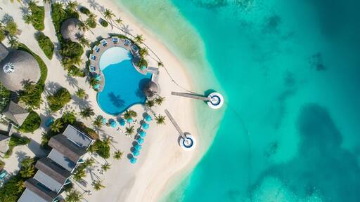 Aerial view of beautiful island at Maldives in the Indian Ocean. Top view from drone.