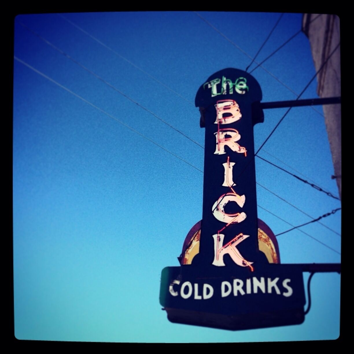 After a long day of exhaustively and unsuccessfully searching for open camping, we were about to throw in the towel when we decided to stop at The Brick for lunch and a much needed beer. This place is full if local charm and small town hospitality. Our server, Amy, greeted us with a big smile and after hearing our woes gave us tons of helpful information and even set us up with a friend of hers who had some land we could camp on.

Along with the charming atmosphere the onion rings are killer and I love the locally brewed Brookside Pale Lager.