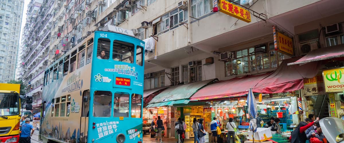 Chun Yeung Street Market showing a city, street scenes and railway items