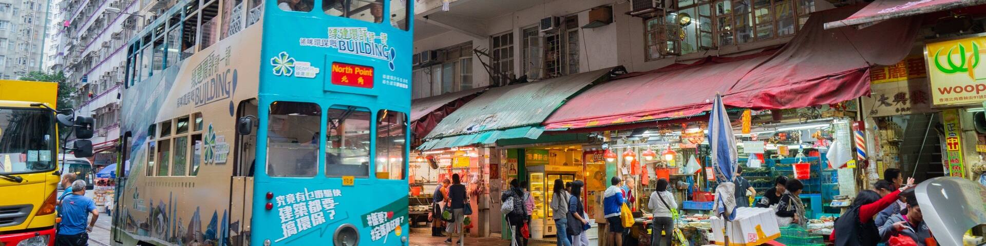 Chun Yeung Street Market showing a city, street scenes and railway items