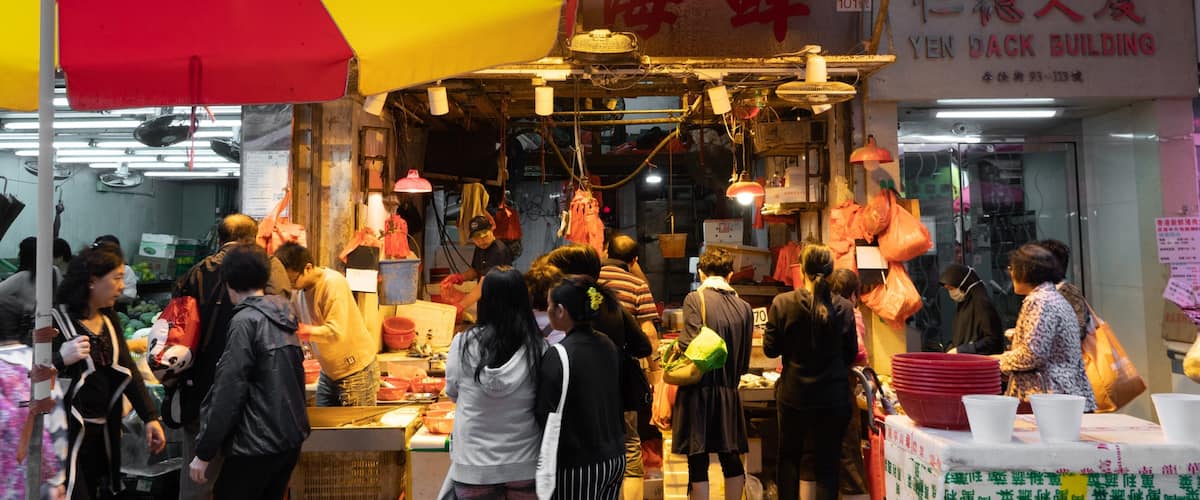 Chun Yeung Street Market featuring markets as well as a large group of people