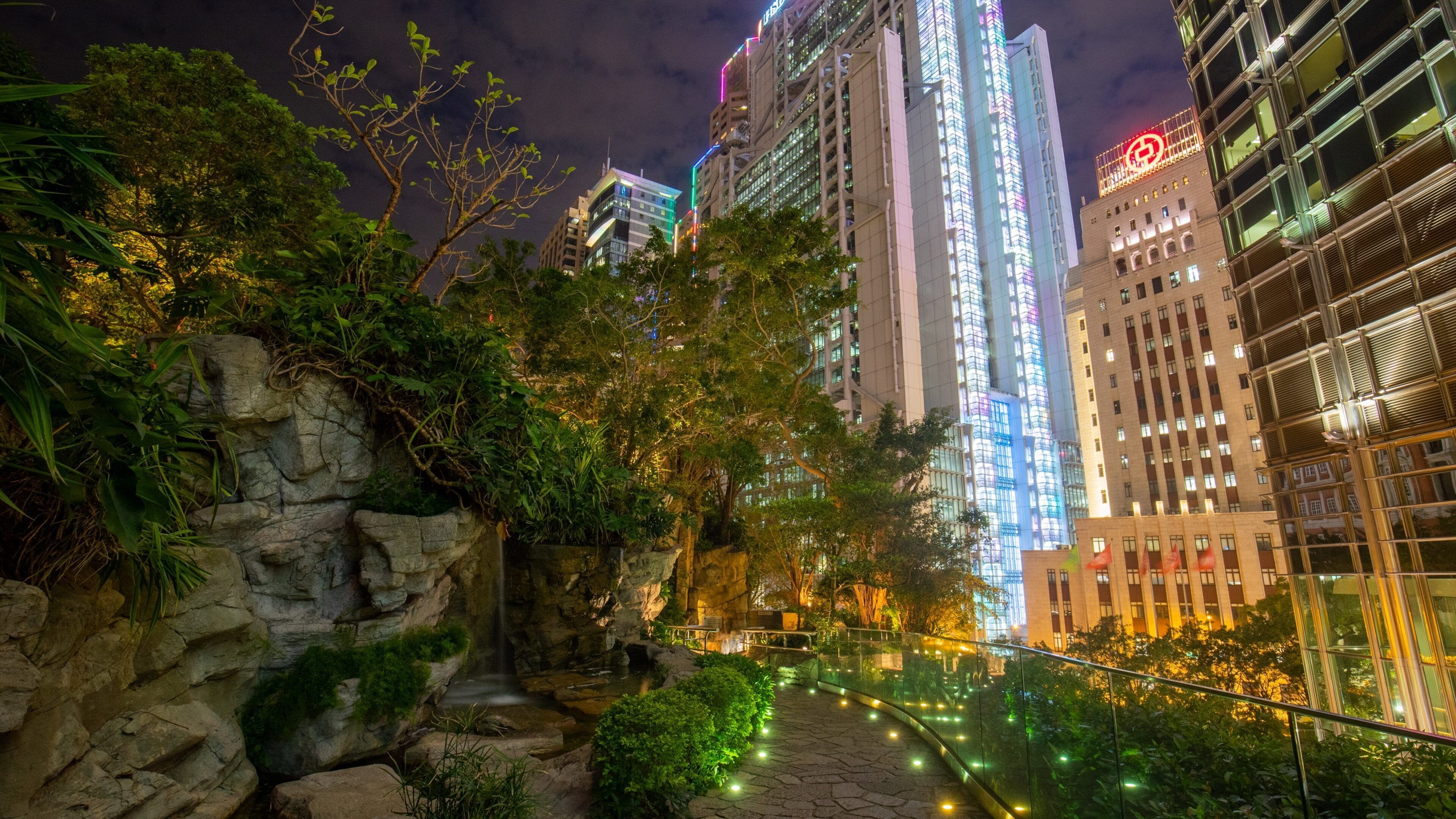 Cheung Kong Park showing a garden, night scenes and a city