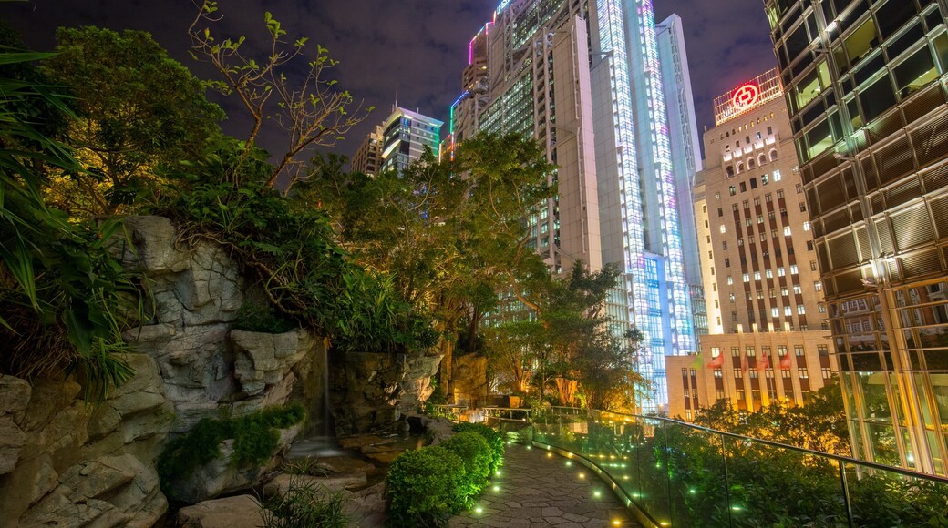 Cheung Kong Park showing a garden, night scenes and a city