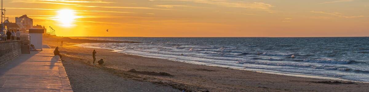 Langrune Sur Mer, France - 08 03 2020: Panoramic view of the sea from the beach at sunset