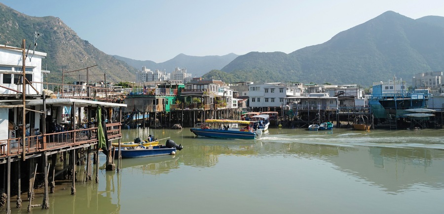 wide photography traditional Hong Kong old wooden house, boat and river in countryside