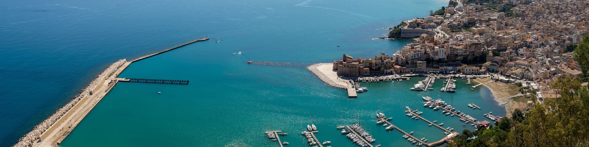 View on small Sicilian seaside town Castellammare del Golfo and golden beaches of Alcamo marina, located in western part of island