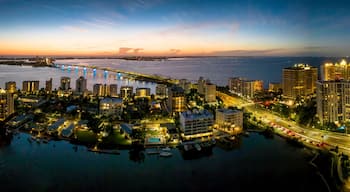 Sarasota aerial blue hour with city and Ringling bridge lit up.