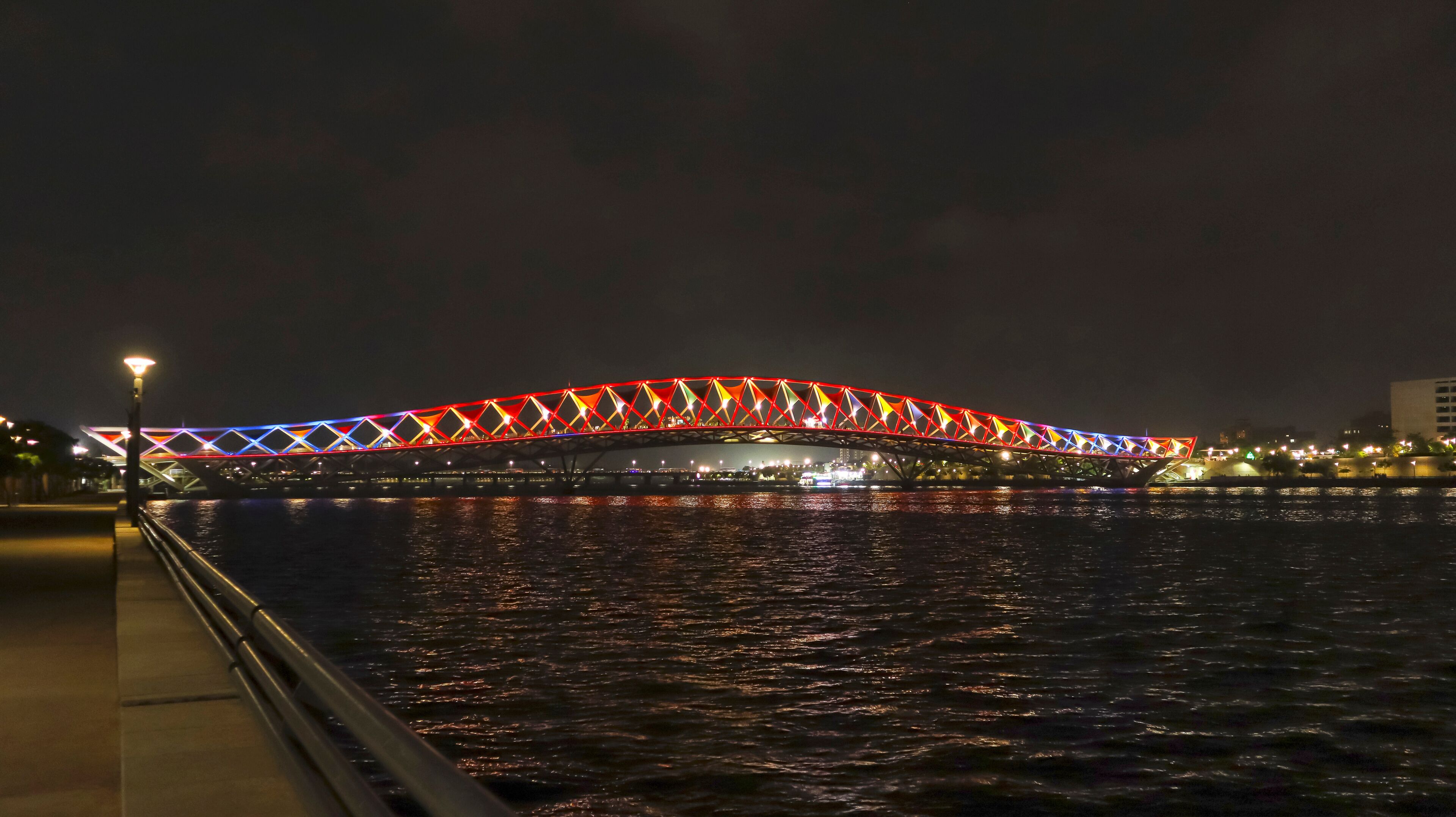 Night view of Atal Bridge with beautiful lights, Sabarmati Riverfront, Ahmedabad, Gujarat, India.