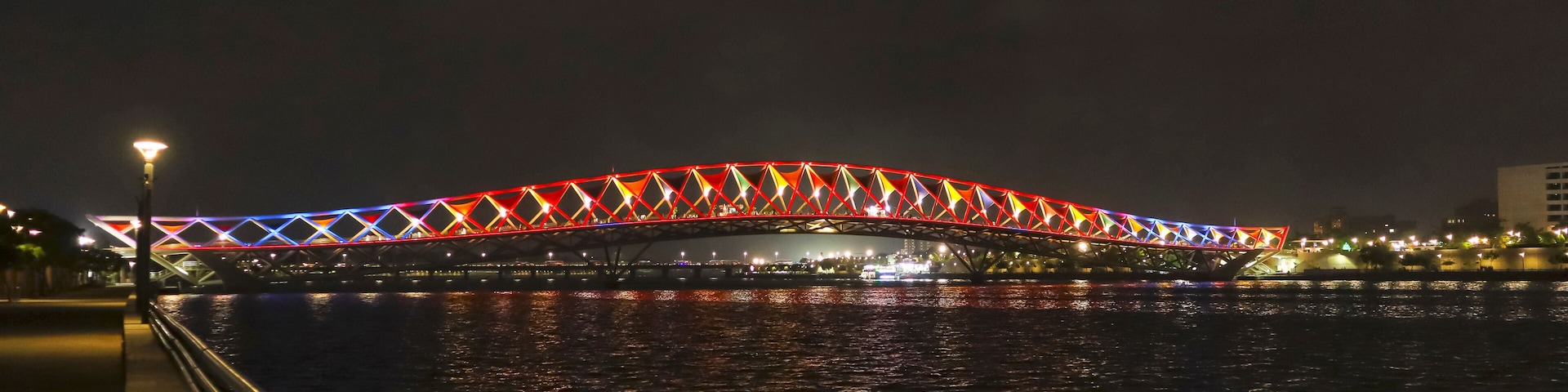 Night view of Atal Bridge with beautiful lights, Sabarmati Riverfront, Ahmedabad, Gujarat, India.