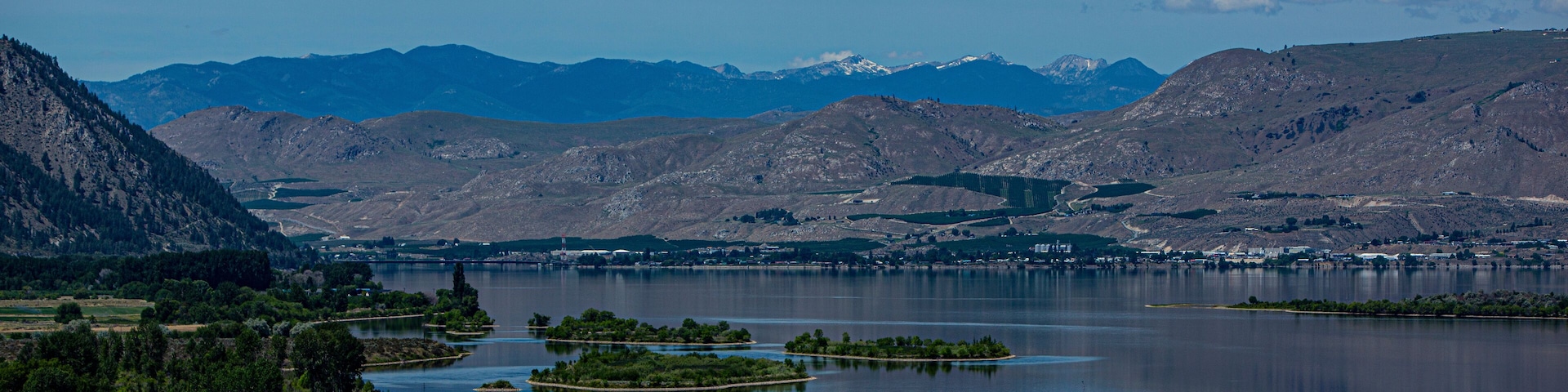 A lake surrounded by mountains and islands.