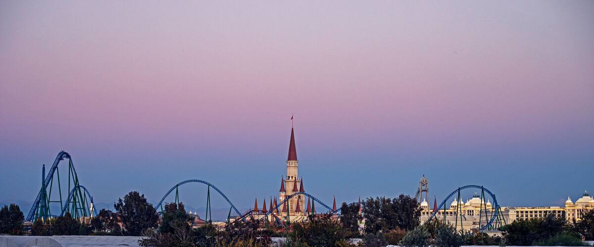 beautiful castle of the park of legends against the background of a lilac sky. Antaly