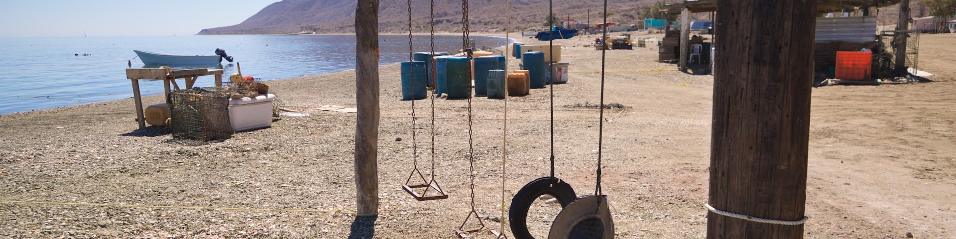 Puerto San Carlos which includes a beach, general coastal views and a playground