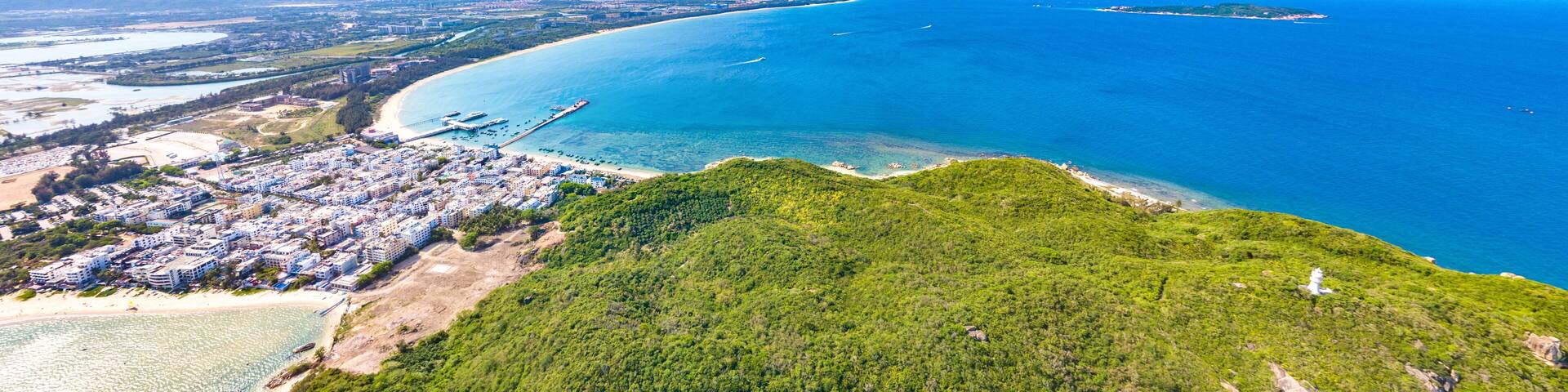 Houhai Bay Aerial Scenery, Sanya, Hainan Province, China, a Tourist Attraction with Leisurely Fishing Village and Wuzhizhou Island Cruise Terminal at the Southern Tip of Haitang Bay.