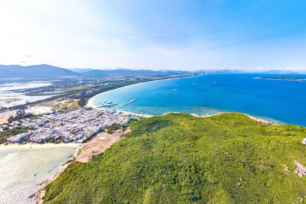 Houhai Bay Aerial Scenery, Sanya, Hainan Province, China, a Tourist Attraction with Leisurely Fishing Village and Wuzhizhou Island Cruise Terminal at the Southern Tip of Haitang Bay.