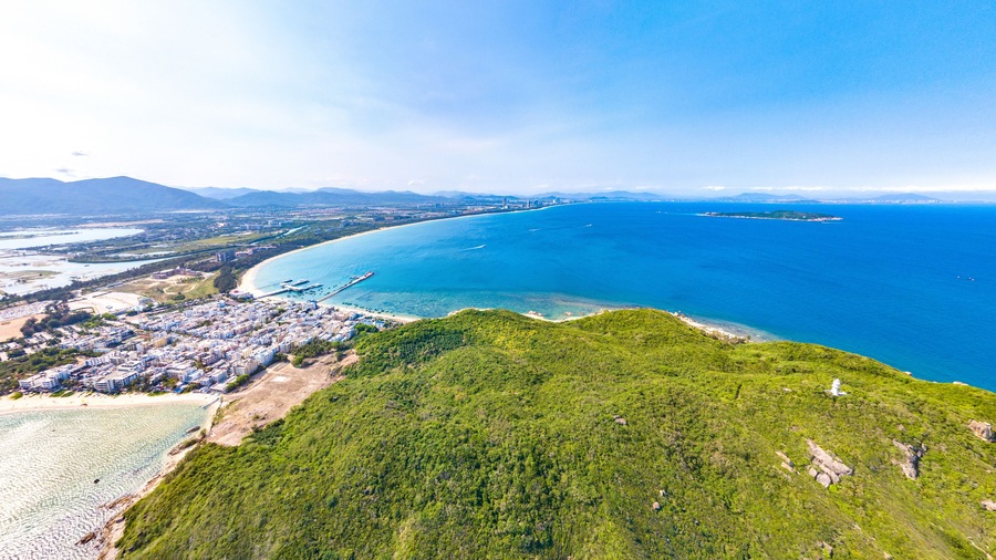 Houhai Bay Aerial Scenery, Sanya, Hainan Province, China, a Tourist Attraction with Leisurely Fishing Village and Wuzhizhou Island Cruise Terminal at the Southern Tip of Haitang Bay.