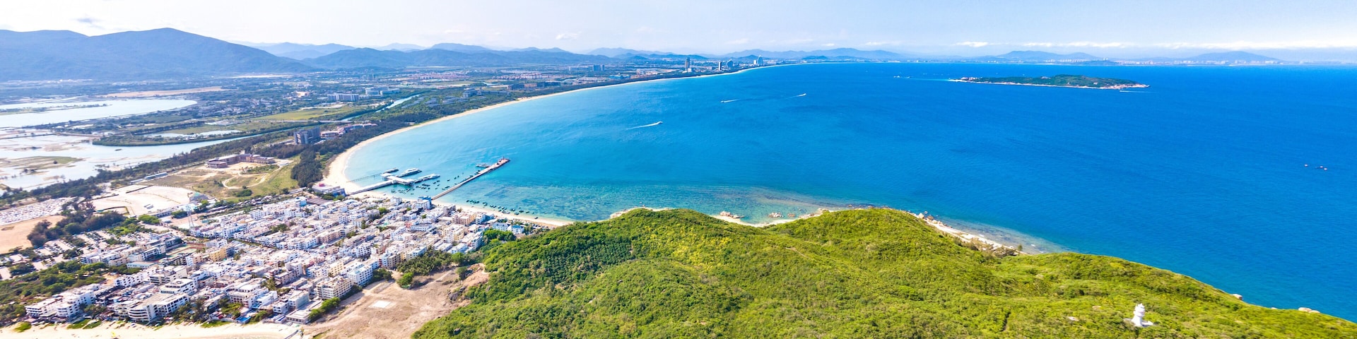 Houhai Bay Aerial Scenery, Sanya, Hainan Province, China, a Tourist Attraction with Leisurely Fishing Village and Wuzhizhou Island Cruise Terminal at the Southern Tip of Haitang Bay.