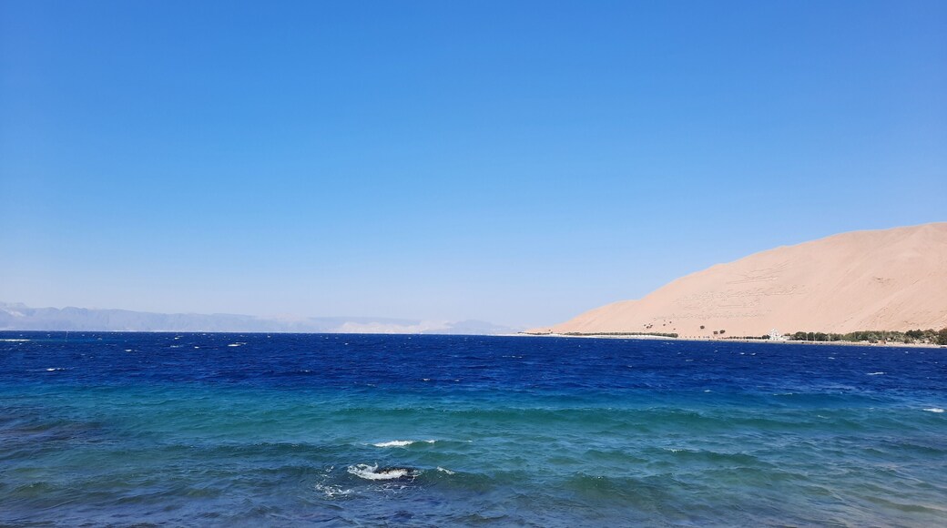 The mesmerizing view of the deep blue waters of Haql beach in Saudi Arabia.
