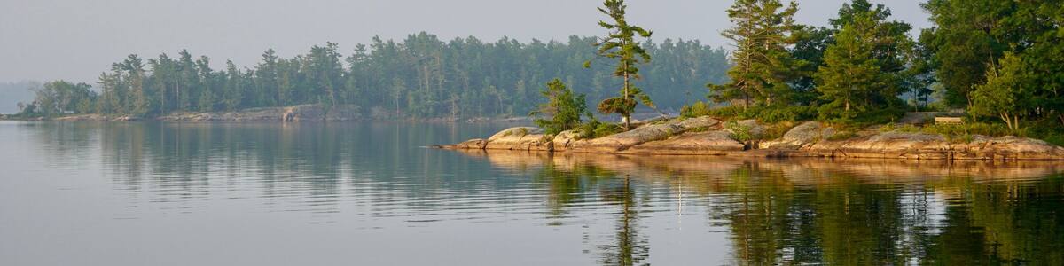 Granite point with pine trees in Georgian Bay at Golden Hour