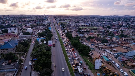 Aerial view of Accra Ghana N1 highway traffic at dusk.