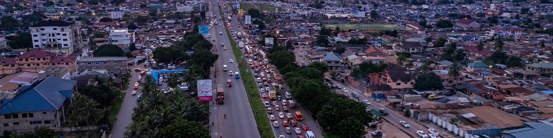 Aerial view of Accra Ghana N1 highway traffic at dusk.