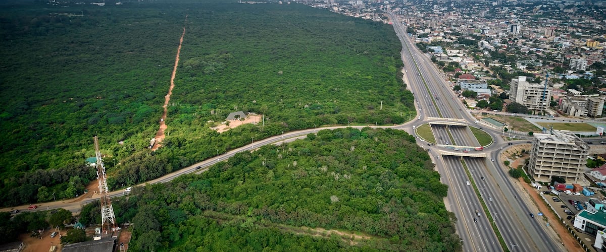 Bird's eye view of the Achimota forest with a highway traffic