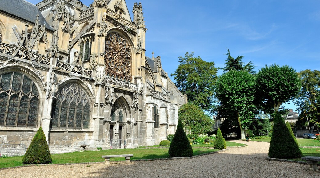 A historic cathedral with intricate Gothic architecture, including pointed arches and detailed stone carvings.