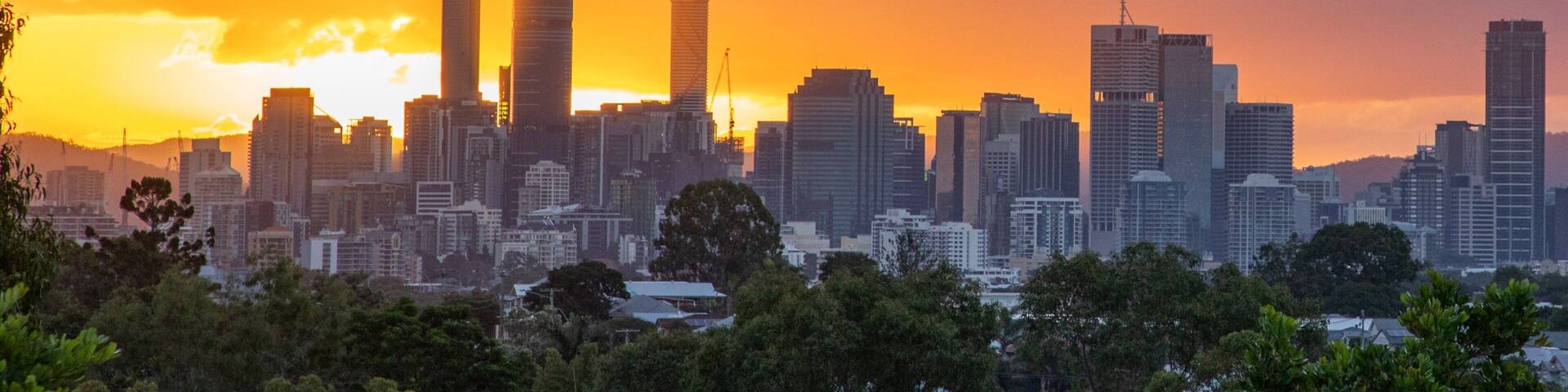 Camp Hill showing landscape views, a city and a sunset