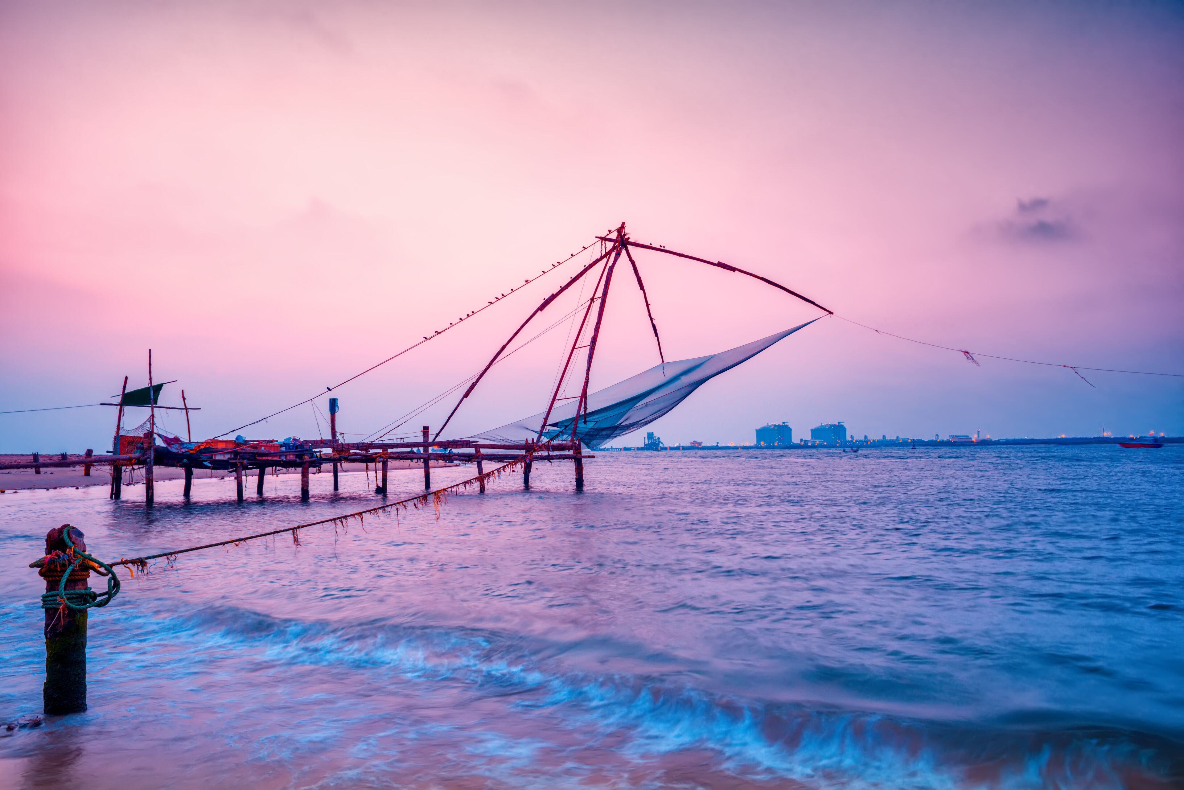 beautiful night scene of Kochi chinese fishnets in twilight Kochi, Kerala. Fort Kochin, Kochi, Kerala, south India, neon colors