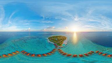Luxurious overwater villas on Alimatha Island in the Maldives, Vaavu Atoll, at sunset. Aerial seamless 360 degree spherical panorama