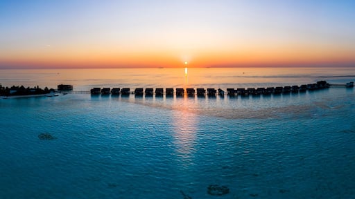 Maldives, South Male Atoll, Aerial view of lagoon of the Maldives island of Maadhoo at sunset