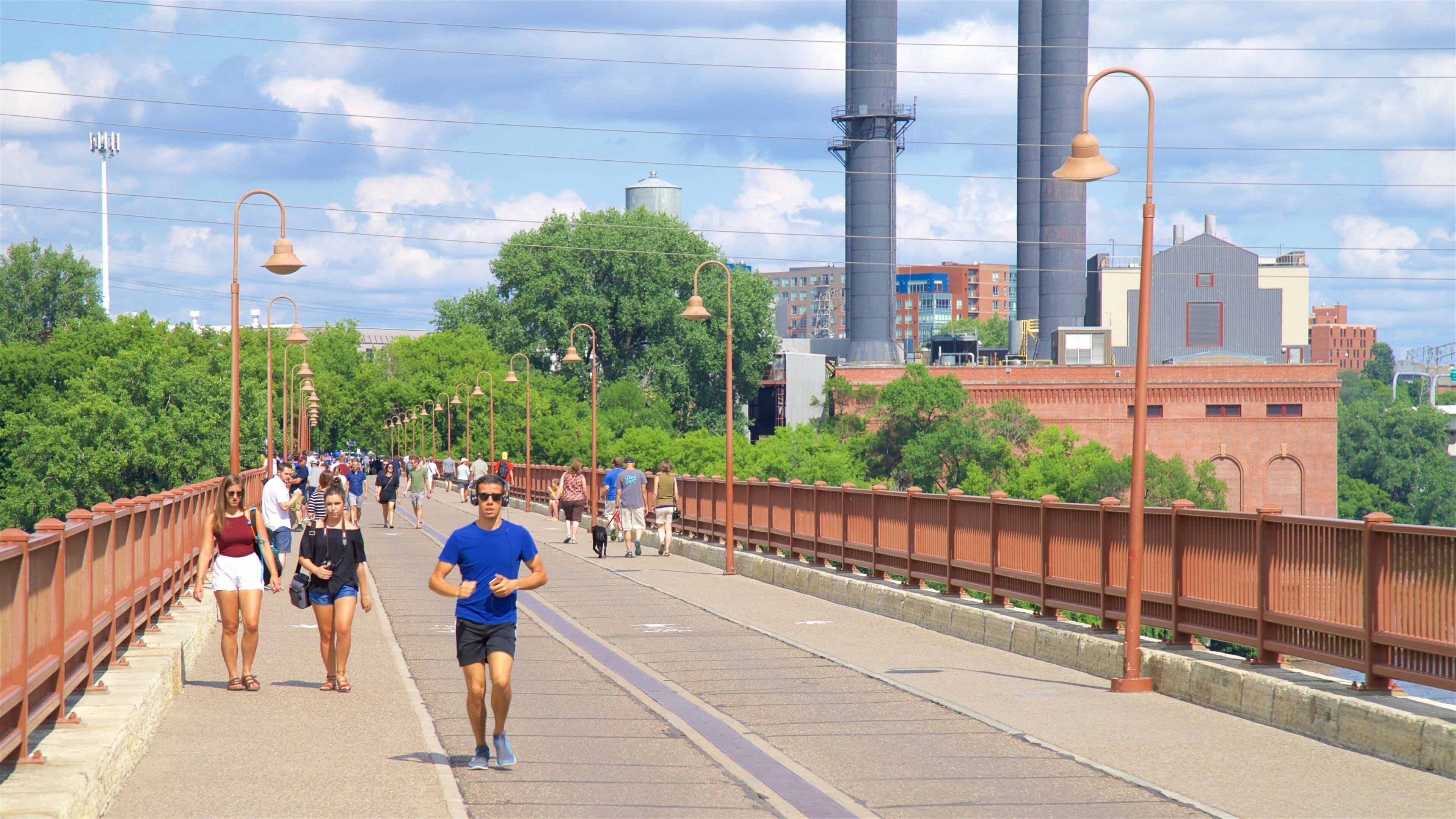 Stone Arch Bridge featuring a bridge as well as a small group of people