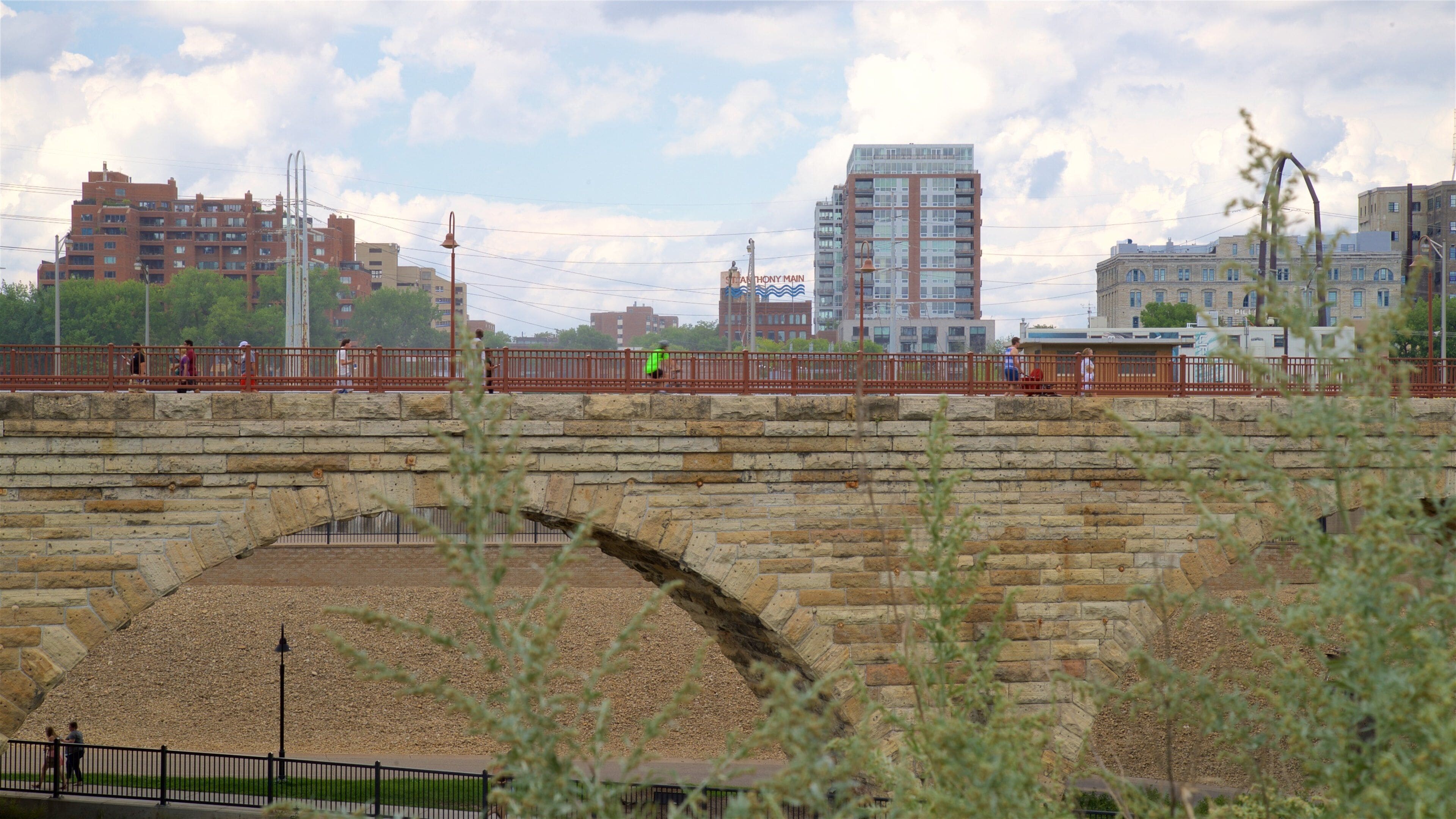 Stone Arch Bridge which includes a city, a bridge and a river or creek