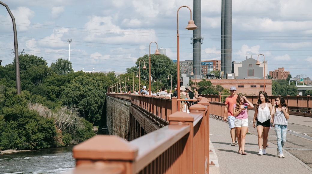 Stone Arch Bridge which includes a bridge and street scenes as well as a small group of people