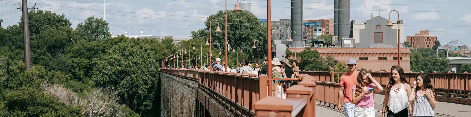 Stone Arch Bridge which includes a bridge and street scenes as well as a small group of people