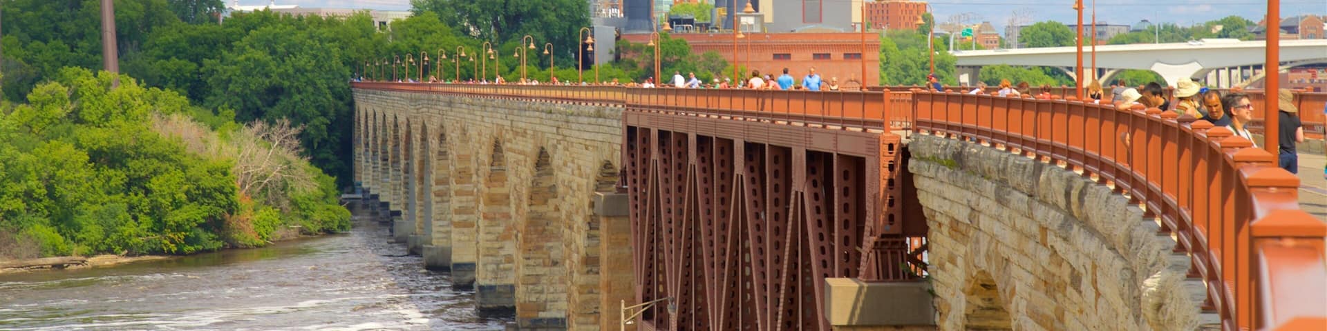 Stone Arch Bridge featuring a bridge and a river or creek