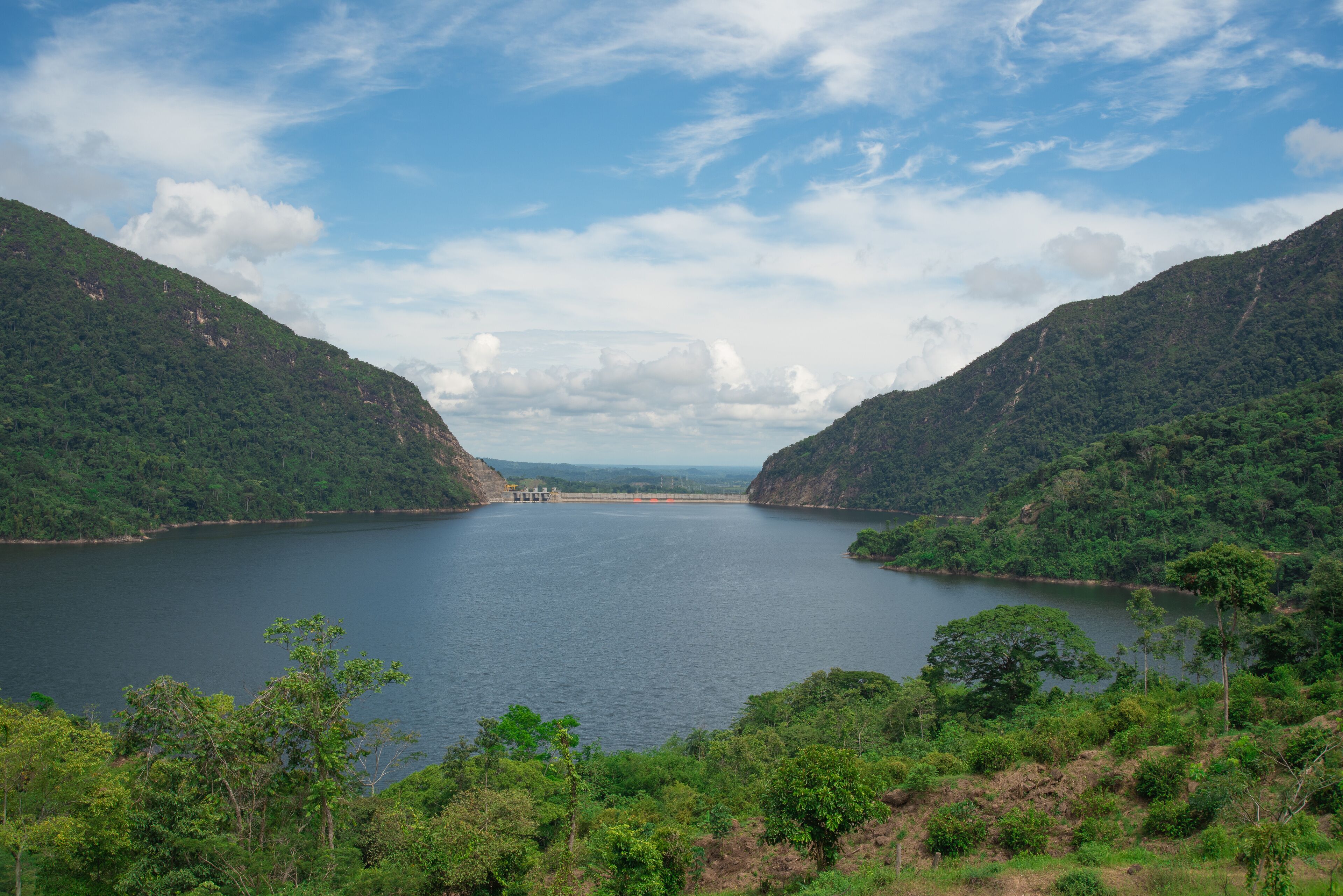 A large lake surrounded by lush green hills.