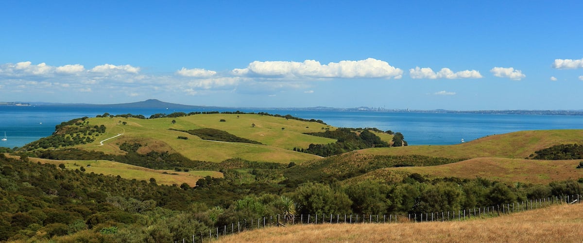 Scenic view (panorama) of Shakespear Regional Park and the Hauraki Gulf, with Rangitoto Island and Auckland City in the background, from Whangaparaoa Peninsula, Auckland, New Zealand