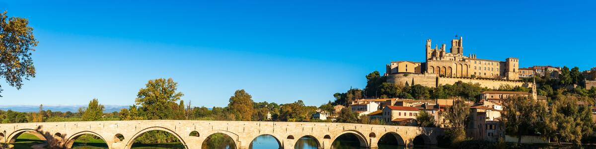Old bridge over the Orb river and Saint Nazaire cathedral in Béziers, Hérault, Occitanie, France