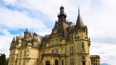 A grand, historic building with multiple towers and ornate architecture.