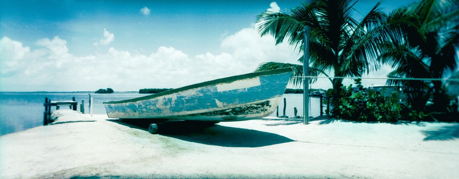 Boat moored on the beach, San Pedro, Ambergris Caye, Belize.