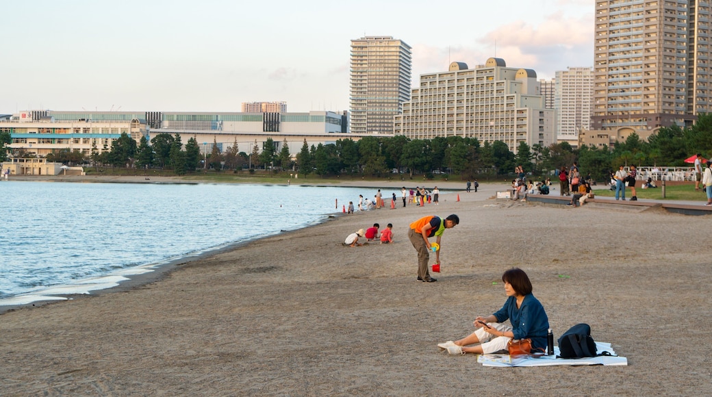 Odaiba Beach Park which includes a sunset, a river or creek and a beach