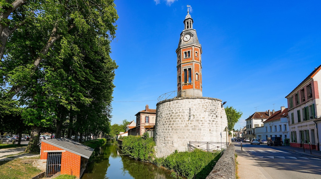 Brick belfry built over the ruins of a medieval fortification tower by the Grand Morin river in Crécy la Chapelle, a village of Seine et Marne in Paris region (France) nicknamed "Venice of Brie"