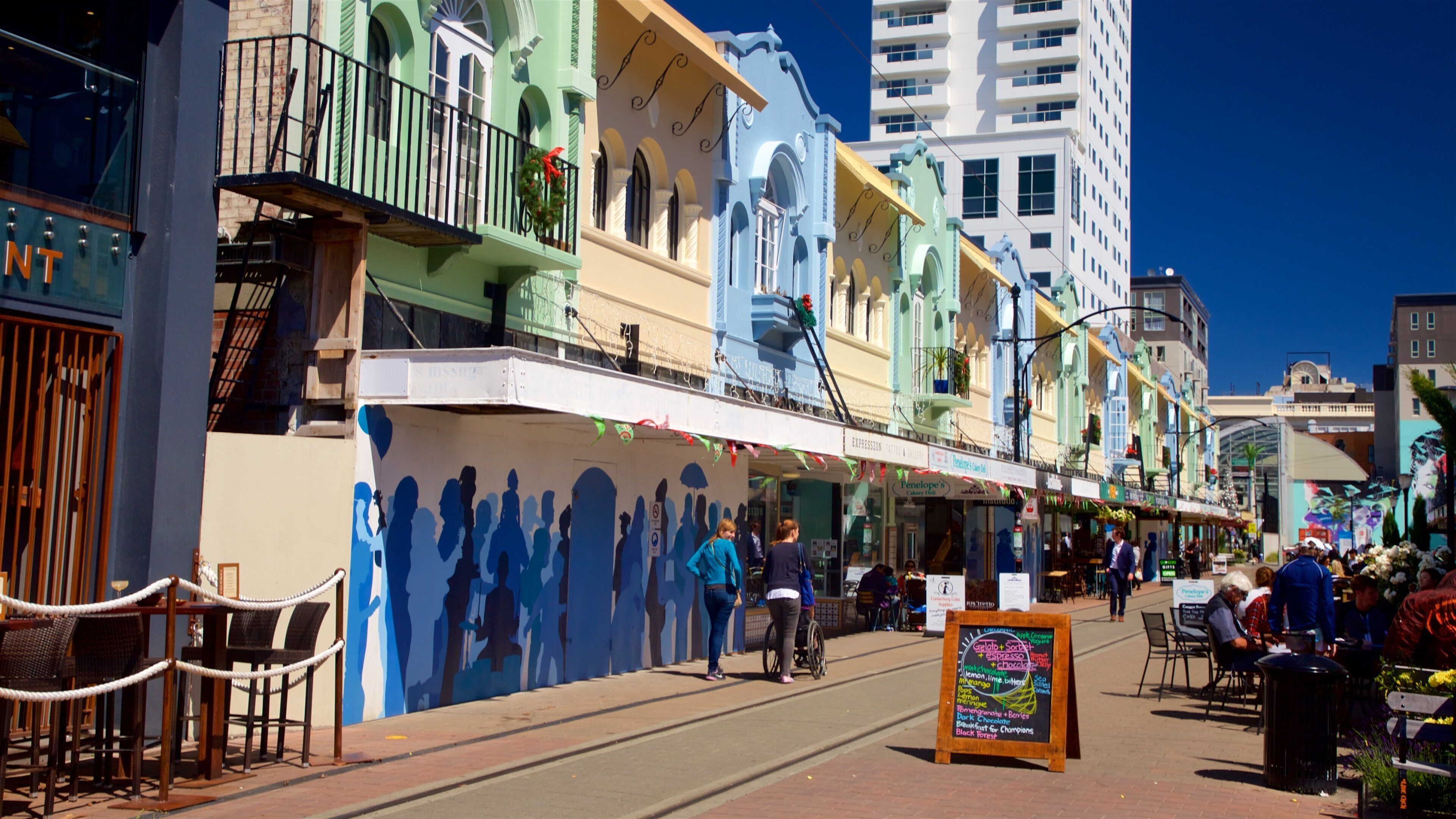 New Regent Street which includes signage as well as a small group of people