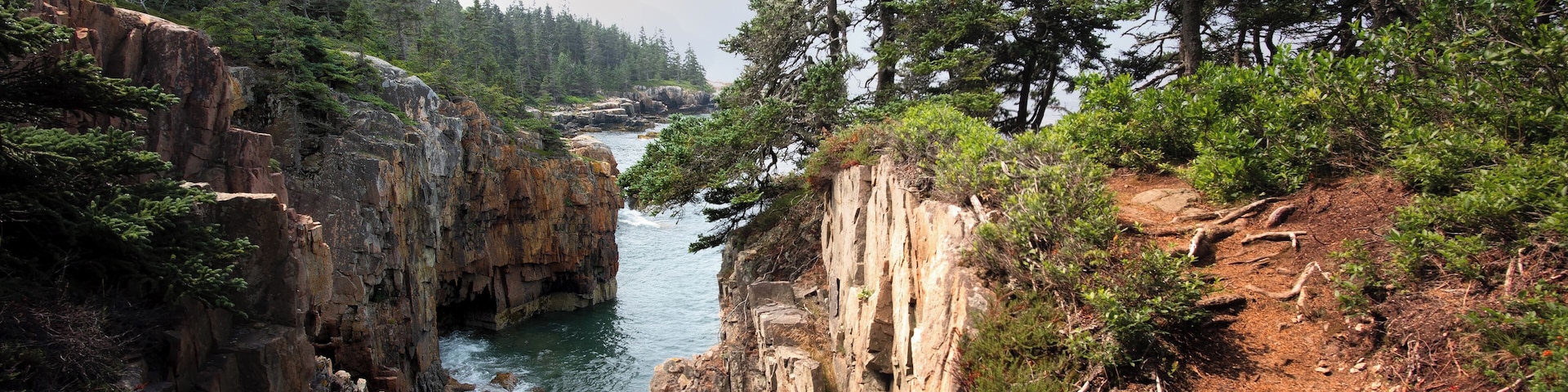 This is a particularly pleasing view from Raven's Nest. The Sun was able to peek through every now and then through the mist and clouds. The tide below as it moved in and out made the rounded rocks on the beach make a pleasing "clacking" sound as the tide receded. Subtle strength, not so subtle result. - Acadia National Park.