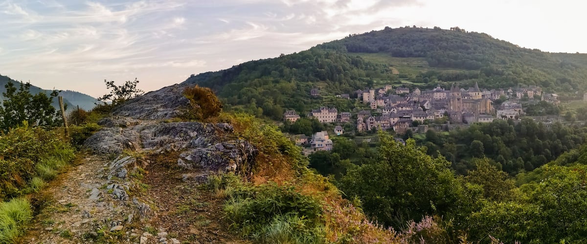 A mountainous landscape with a town nestled among the hills.