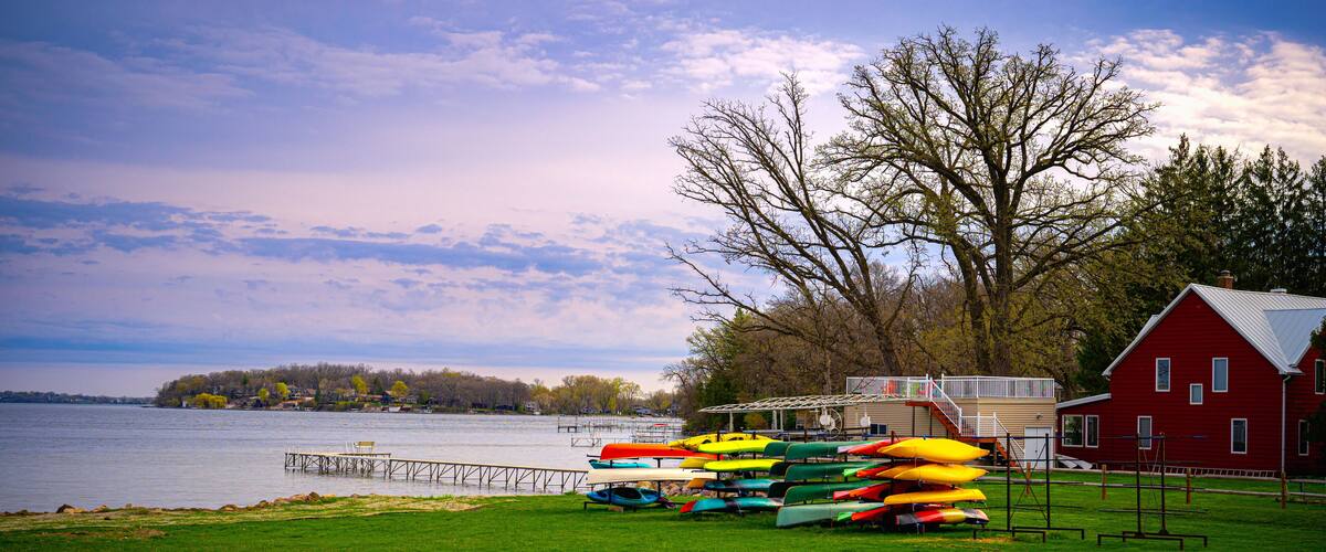 Boathouse and stacked kayaks over the green park at the Lake Monona in Madison, Wisconsin, USA