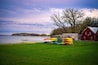 Boathouse and stacked kayaks over the green park at the Lake Monona in Madison, Wisconsin, USA