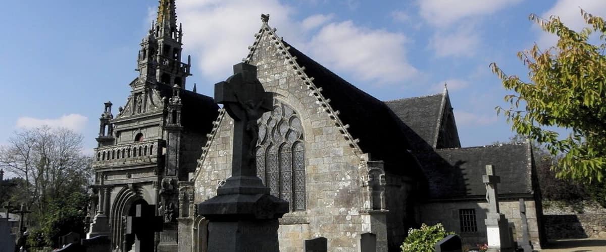 A historic church with a tall spire and Gothic architecture.