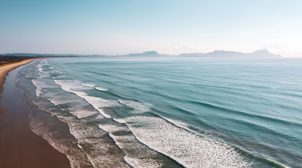 Big waves at New Zealand blue-water Uretiti Beach