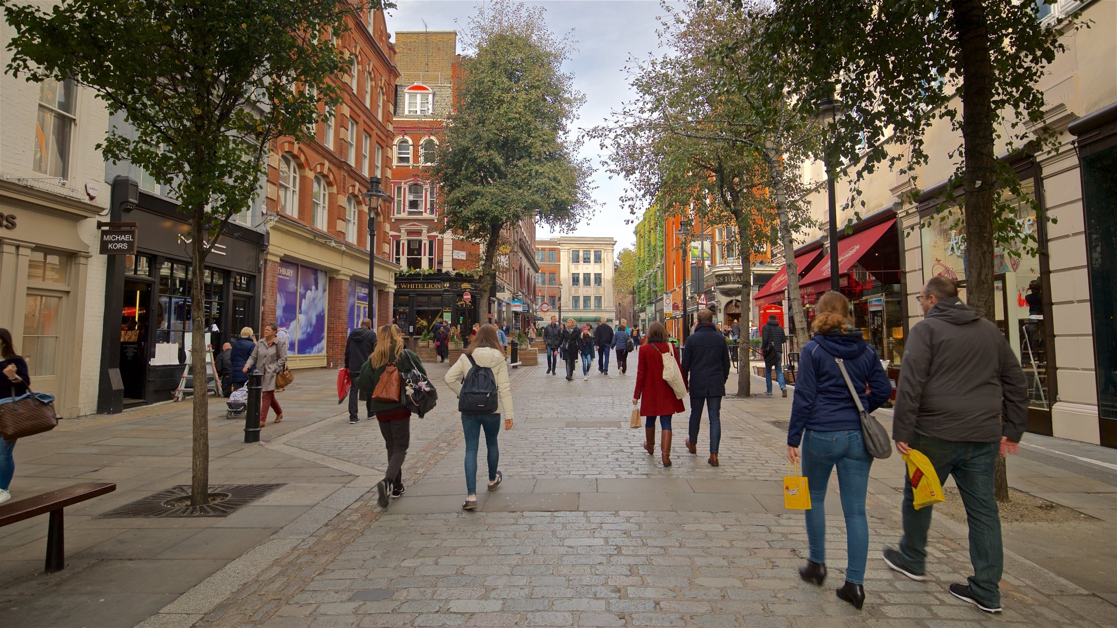 Covent Garden which includes a city and street scenes as well as a couple